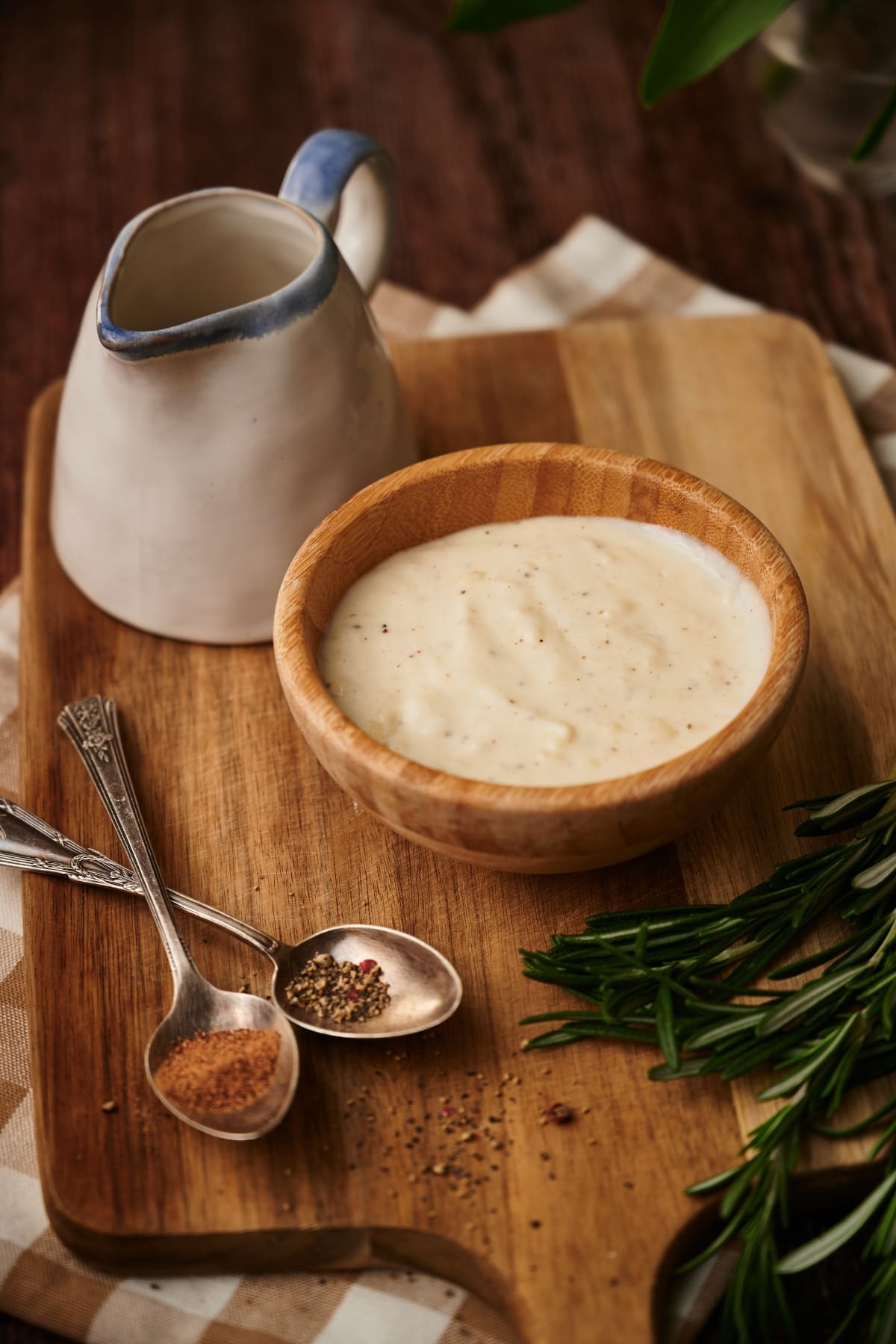 photo of ready besciamella white sauce in a bowl on a table