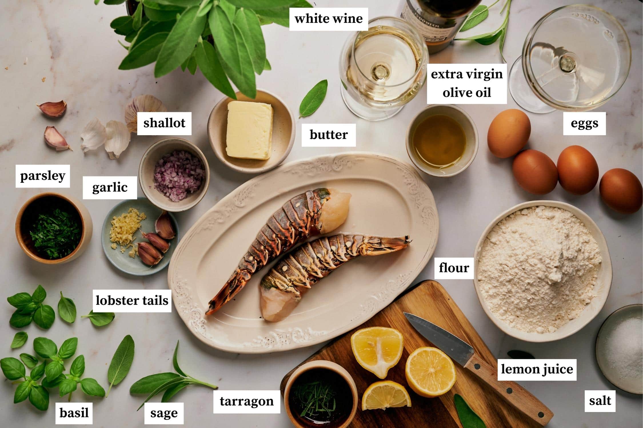 Ingredients for Lobster Ravioli: white wine, extra virgin olive oil, eggs, flour, lemon juice, salt, tarragon, sage, basil, garlic, parsley, shallot and butter.