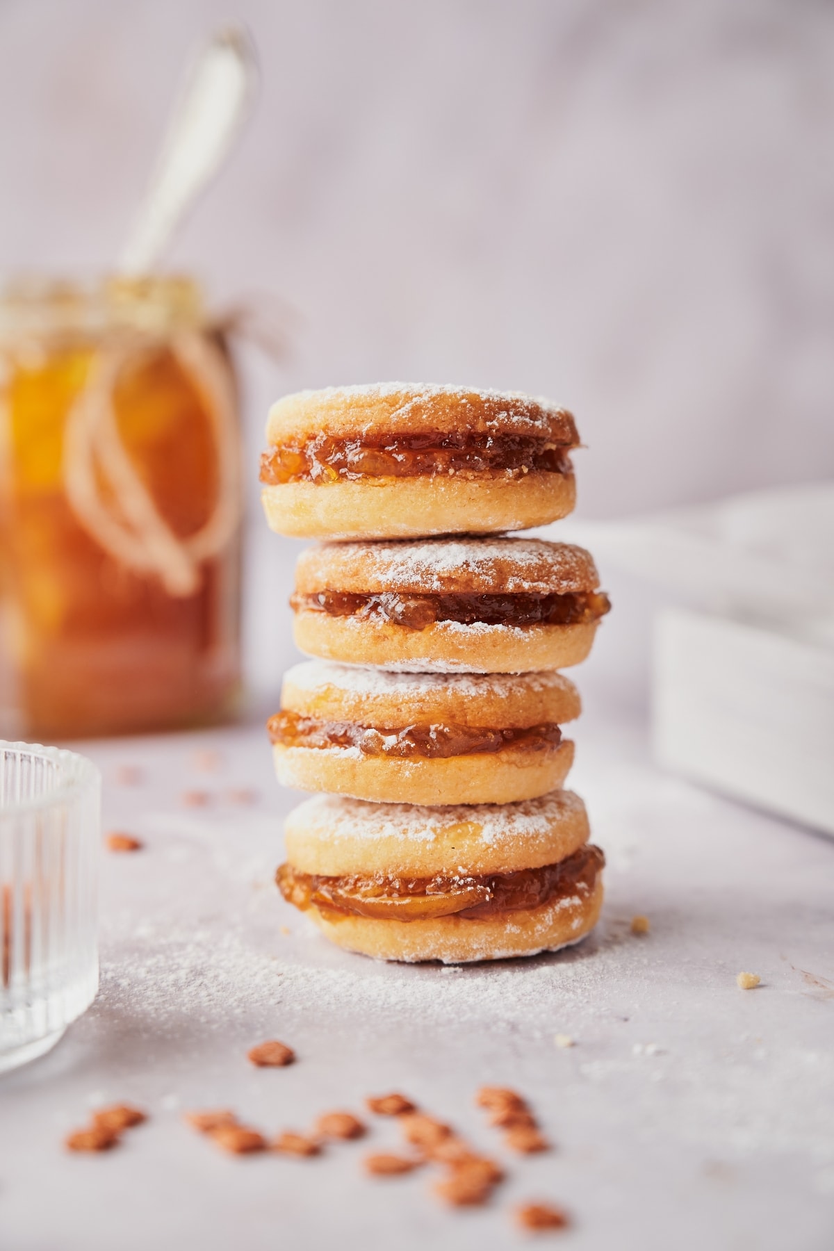 stacked italian butter cookies with apricot jam