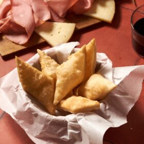 gnocco fritto on a table with cured meat