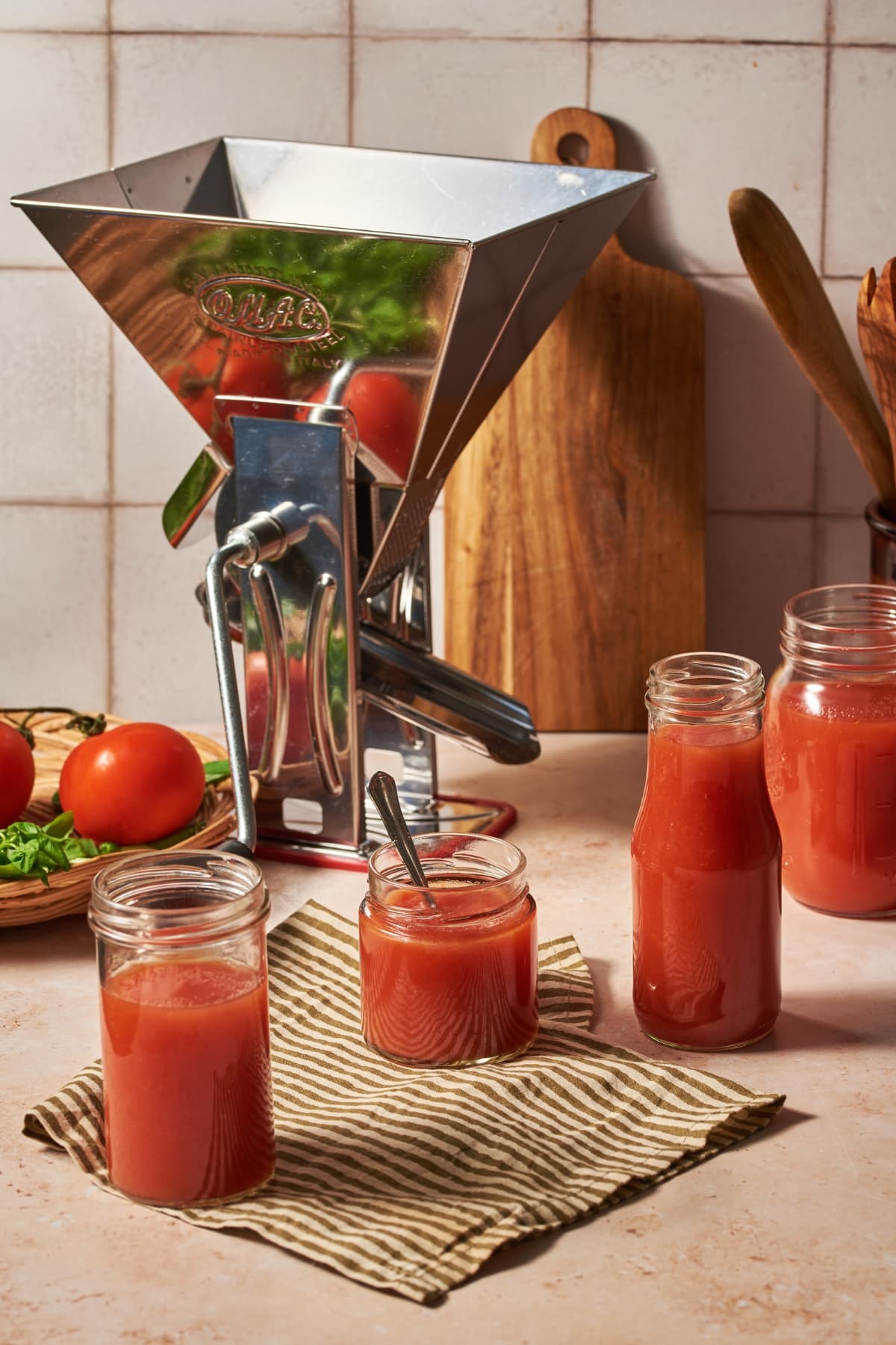 homemade tomato passata prepared in jars on a table