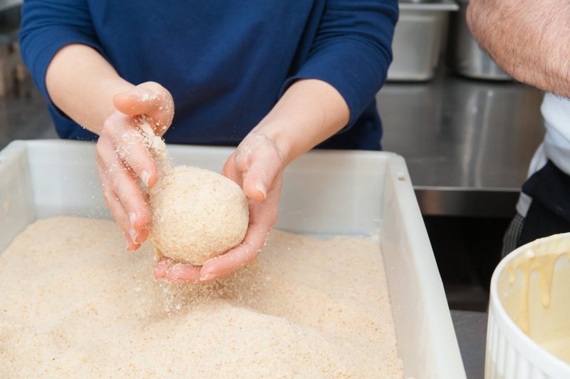 cover the rice balls with breadcrumbs