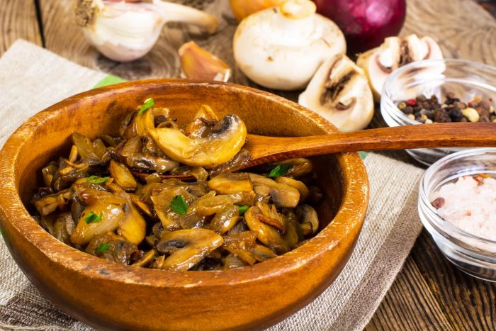 sauteed mushrooms in wooden bowl